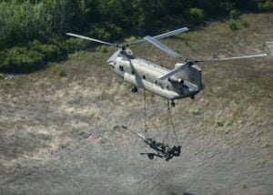 A U.S. Army CH-47F performs a sling load during a training exercise