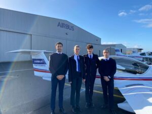 Airbus Flight Academy cadets with their flight instructor in front of an Elixir Aircraft.