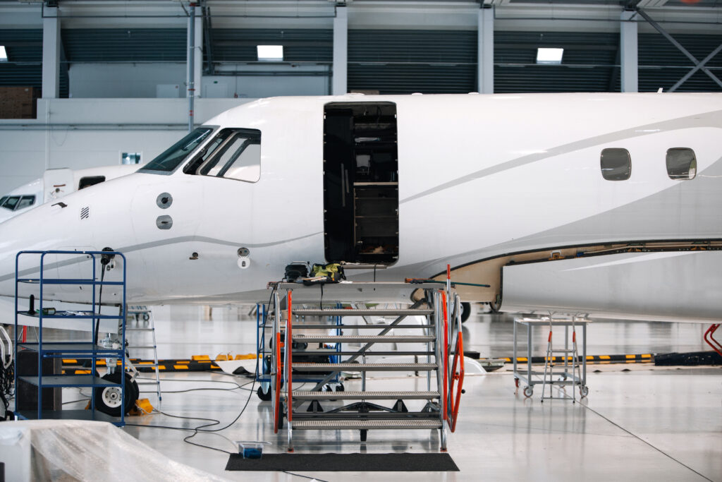 Business jet in a hangar for maintenance