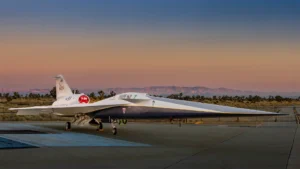 NASA’s X-59 quiet supersonic research aircraft sits on the apron outside Lockheed Martin’s Skunk Works facility at dawn in Palmdale, California