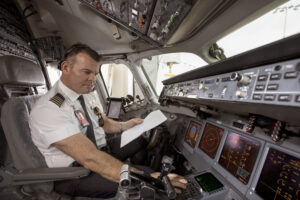 Qantas pilot in the flight deck © Qantas