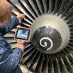 An inspection is being conducted using Waygate Technologies' Mentor Visual iQ+ borescope © GE Aerospace