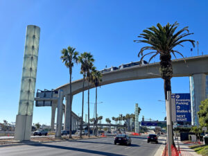 Train vehicles crossing over Sepulveda and Century Boulevards and entering the CTA