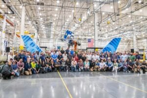 Teammates in the Composite Spar Shop celebrate the start of 777-8 Freighter production