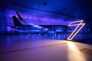 3D light projection illuminated both the aircraft and the walls of Hangar 7