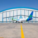 Aircraft in World Star Aviation livery in front of Joramco hangar