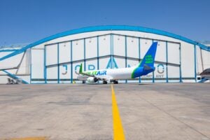 Aircraft in World Star Aviation livery in front of Joramco hangar
