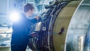 Aircraft,Maintenance,Mechanic,Inspecting,And,Working,On,Airplane,Jet,Engine
