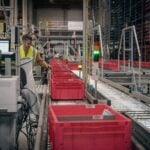 A Daher operator supervises operations in the automated warehouse © Daher