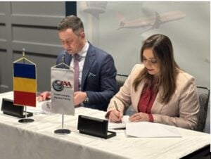The contract was signed between Nicolae Stoica, Director General of the Romanian Civil Aeronautical Authority, and Paula V. de Almeida, Chief Executive Officer of JAA TO