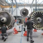 SR Technics employees work on the CFM56 engines