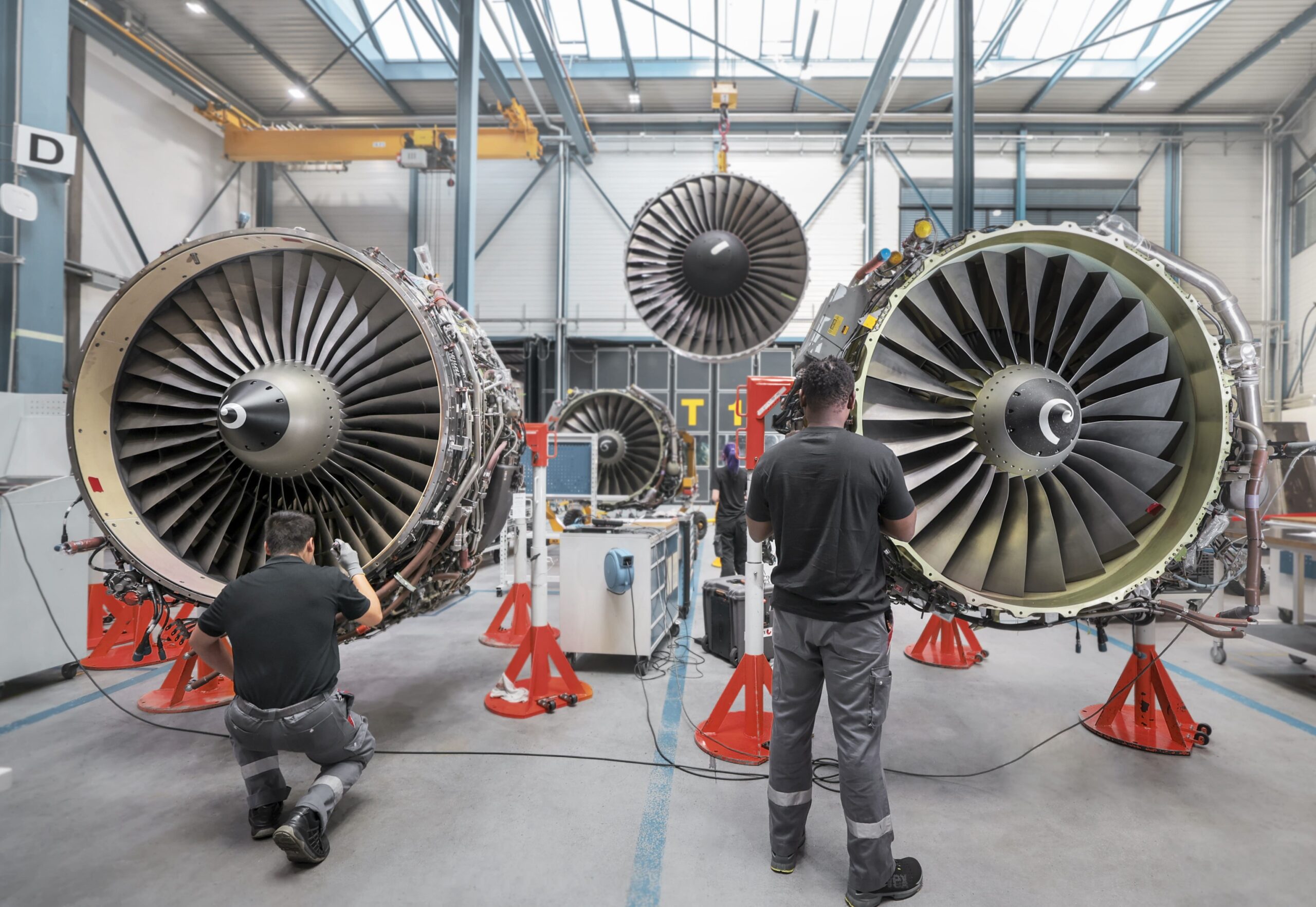 SR Technics employees work on the CFM56 engines